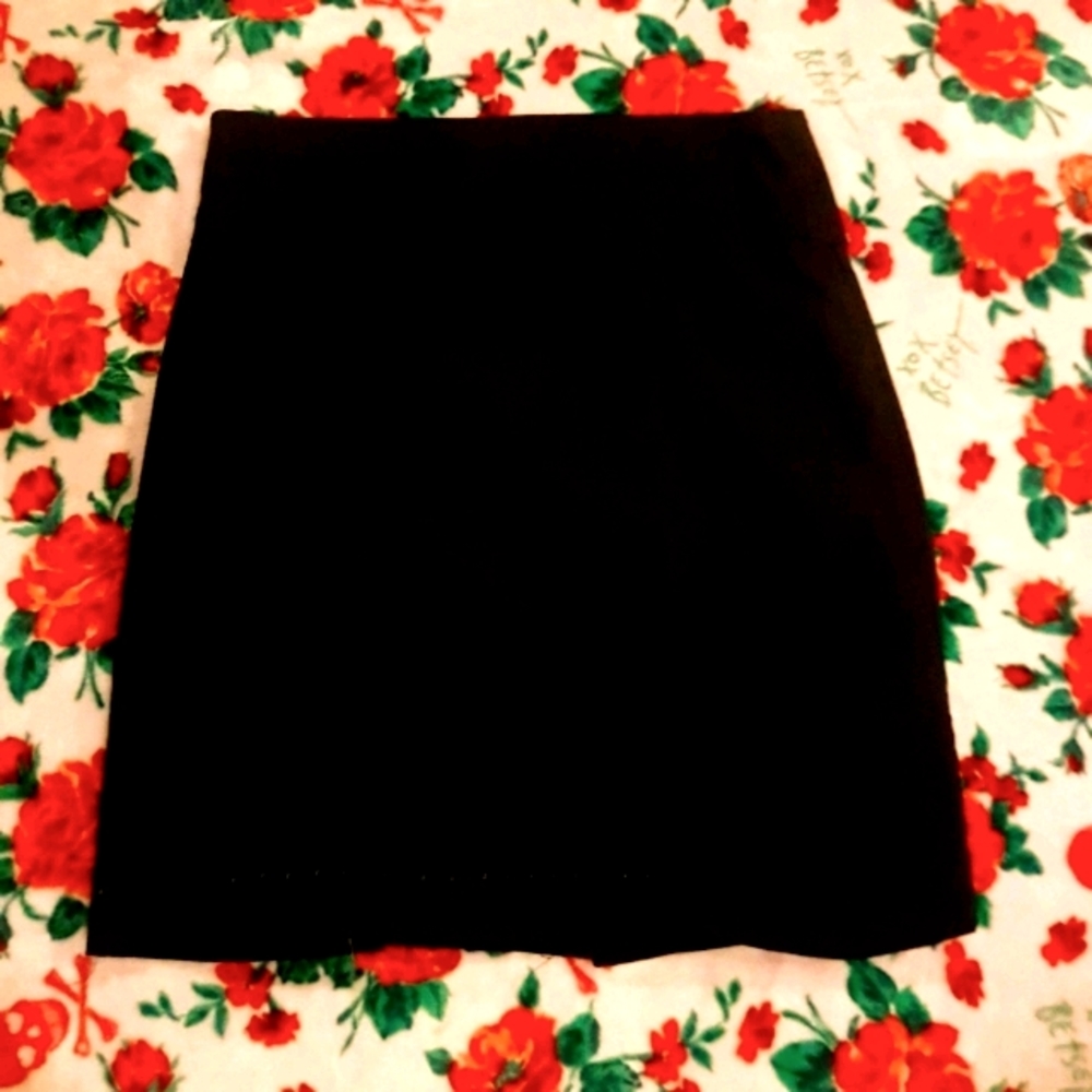 Black skirt with small slit up middle of back